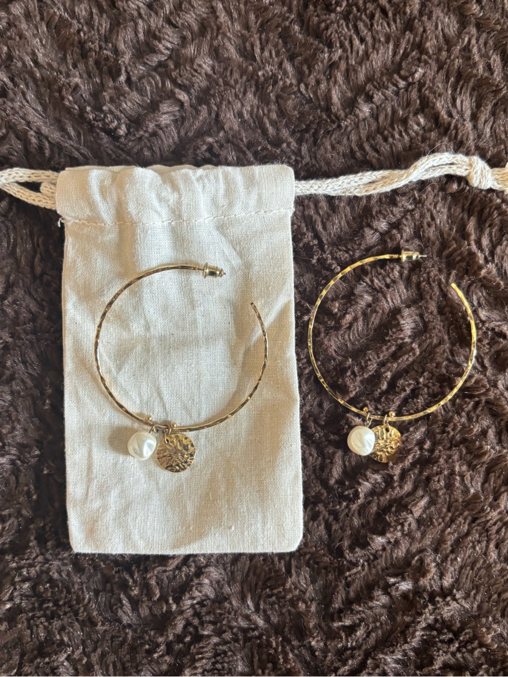 Gold and Pearl large hoop earrings with beige jewelry bag